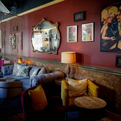 Sofas, tables and chairs, different decorations on the wall