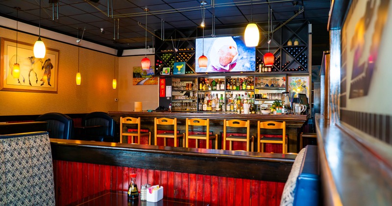 Interior, restaurant booths and bar behind