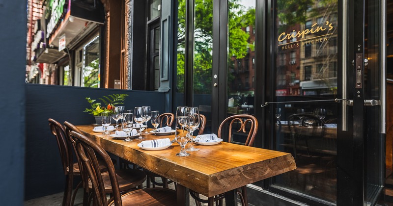 Outdoor seating area, table set for six guests