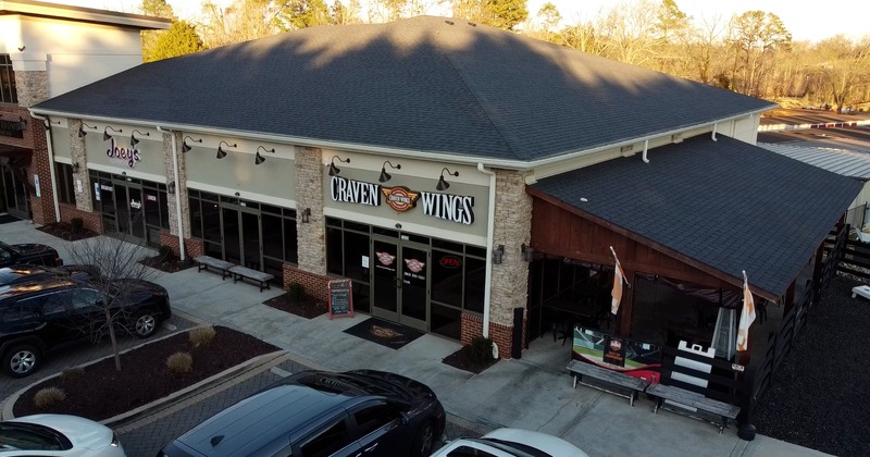 Exterior with signage and parked cars