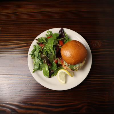 Grilled Chicken Sandwich and salad, top view.