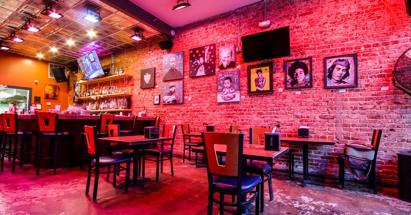 Seating area close to the bar, paintings on the wall