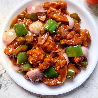 Spicy Chili Chicken with bell peppers and onions.