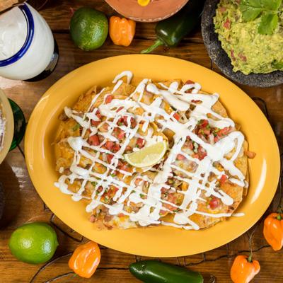 Nachos, with melted mozzarella, pico de gallo, pinto beans and sour cream