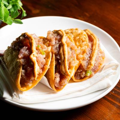 Crispy ahi tuna tacos, served, front view.