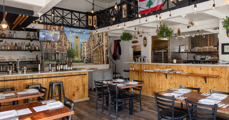Interior, tables and chairs near bar