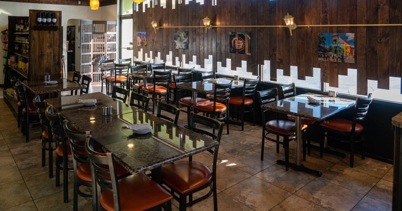 Interior, tables, chairs, wooden decorations, lights, pictures, windows