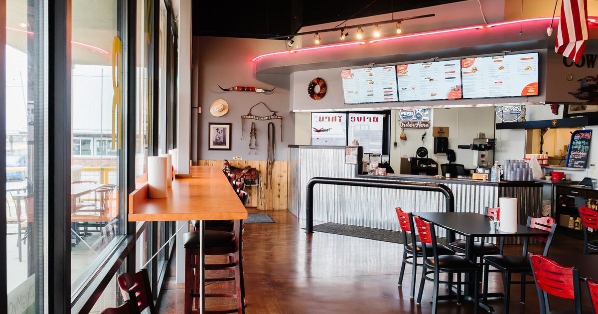 Interior dining area, counter seating along the window and order counter