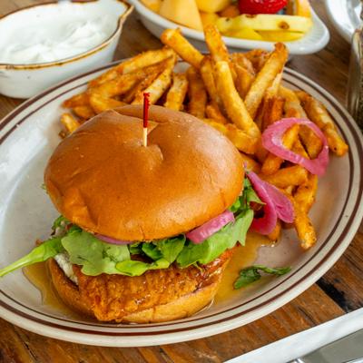 Hot Honey Chicken Burger served with a side of fries.