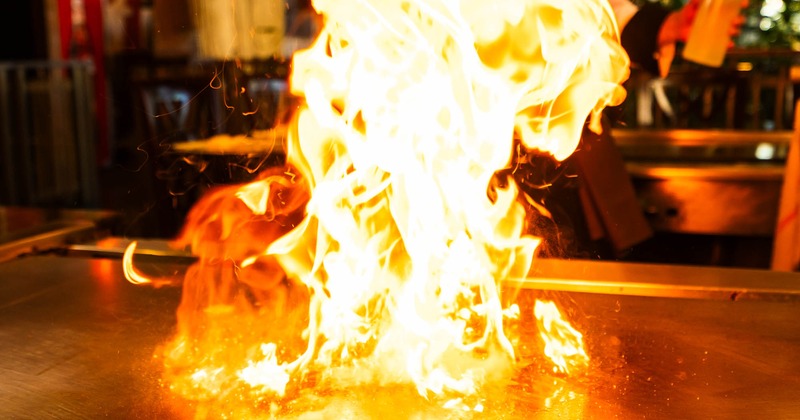 A blazing fire of hibachi grill