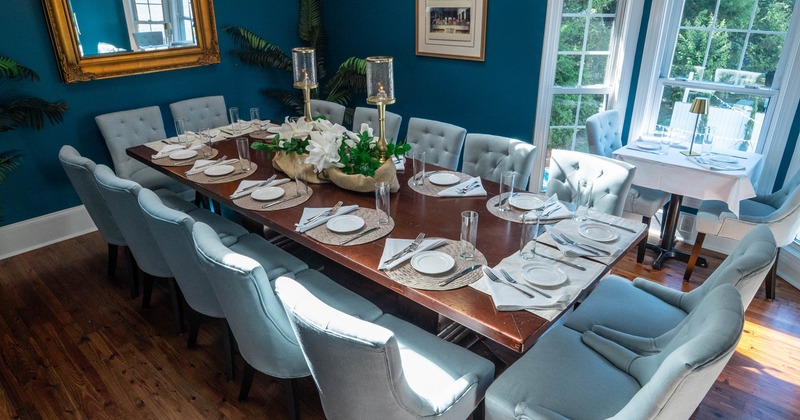 Interior, table with glasses, tableware and plates