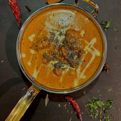 Portion of Butter Chicken, top view.