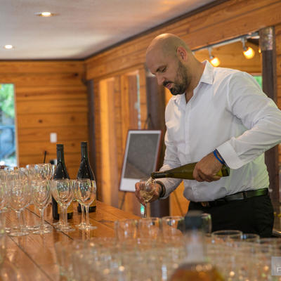 Barmen pouring champagne