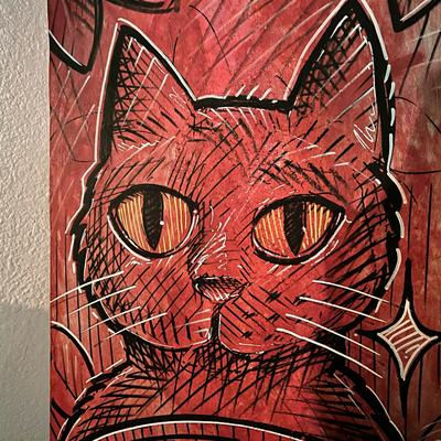 A wall mural of a cat.