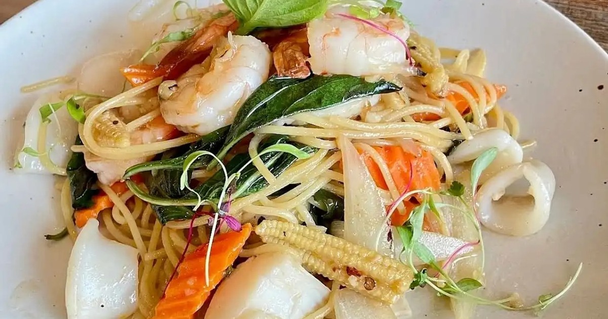 Seafood noodle stir-fry with shrimp, squid, and mixed vegetables