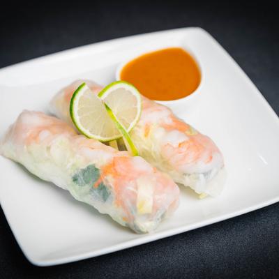 Fresh summer rolls served with peanut sauce.