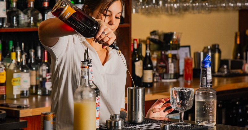 A person serving drinks