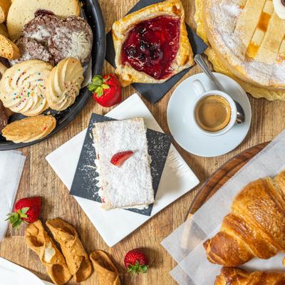 Assorted baker's confections displayed together on a table, top view.