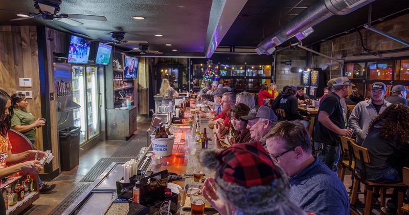 Interior, bar area full of guests