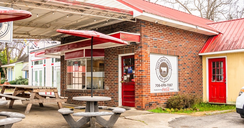 Outdoor seating area in front of the restaurant entrance