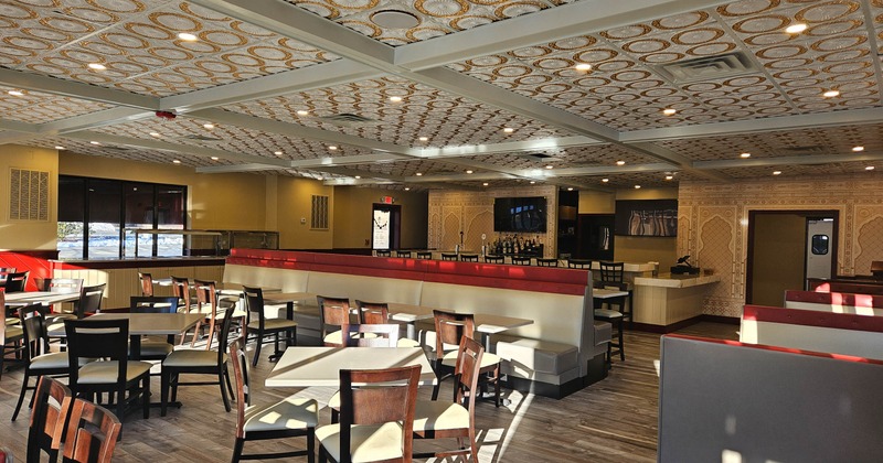 Interior of a modern restaurant with arranged tables and chairs