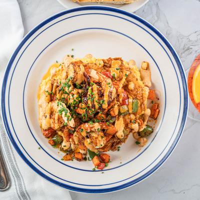 Surf and Turf, with bistro filet, shrimp, mash, sweet chili sauce, and mushroom gravy.