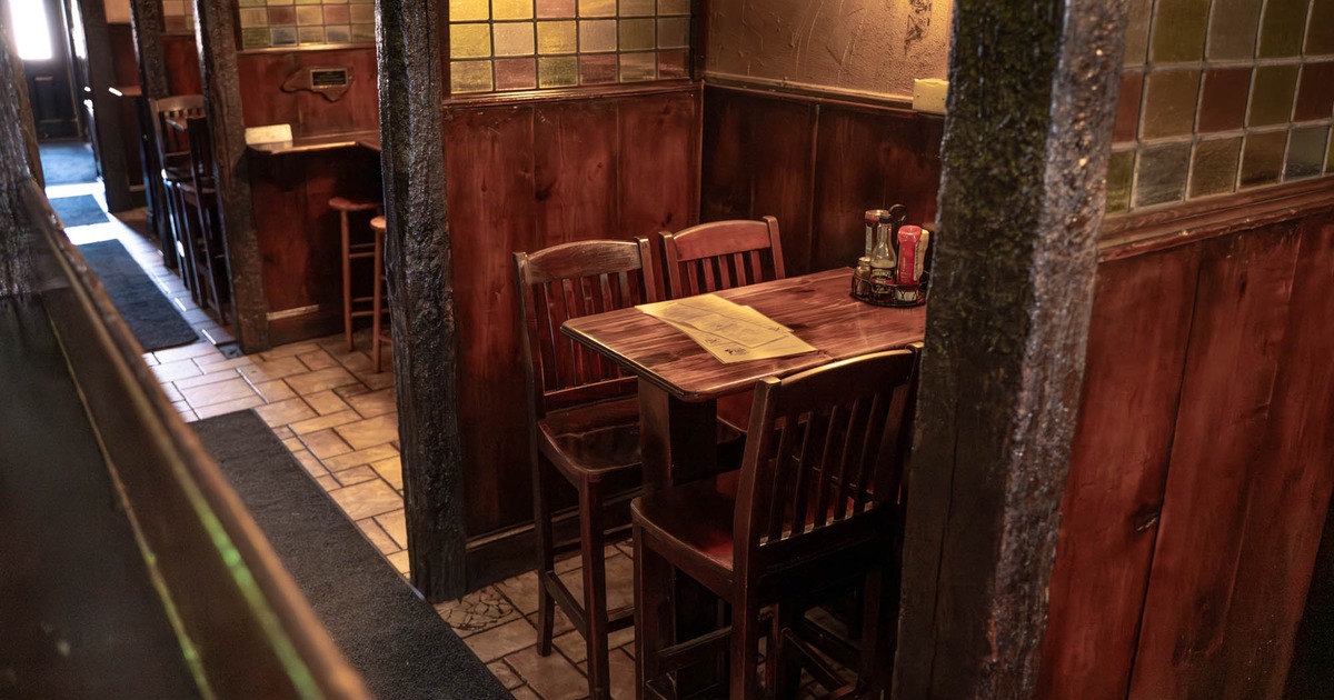 Interior, dining area, high wooden top tables with wooden stools, room dividers
