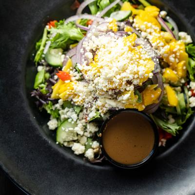 Salad with mixed ingredients, top view