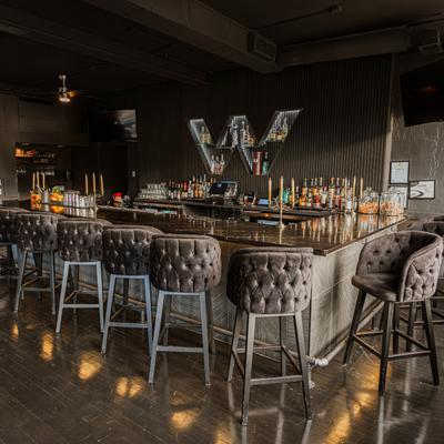 Interior, bar, chairs around.