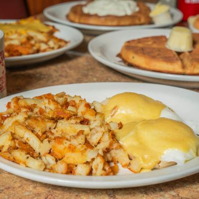 Eggs Benedict with home fries.