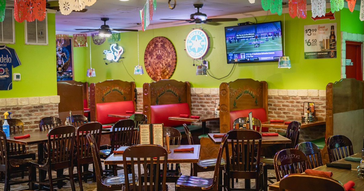 Interior, seating area with booths in the back