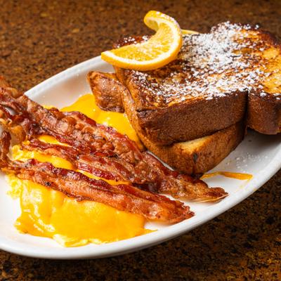 French toast with bacon and eggs.