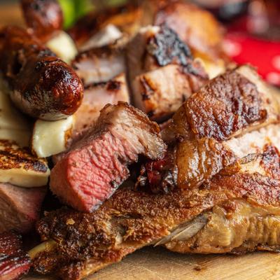 Picada Mixta featuring grilled meats and sausage.