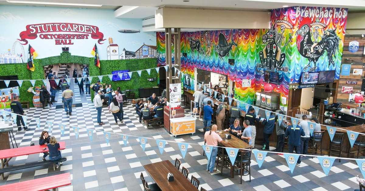 Aerial view of the tavern interior, colorful wall mural