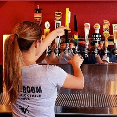 Staff member pouring beer for guests