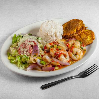 Sauteed shrimp in wine garlic, served with rice, salad and fried plantains.