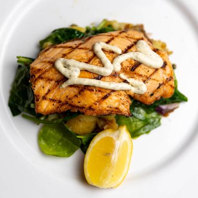 Grilled Salmon, with sauteed spinach, and lemon caper aioli.