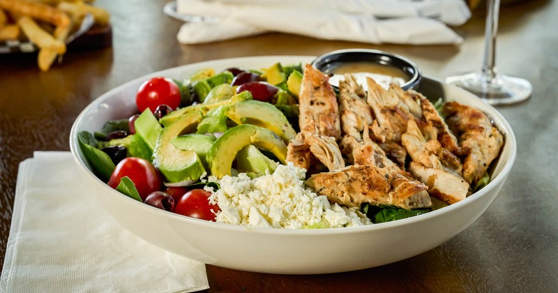 Chicken salad with avocado, tomatoes, and cheese
