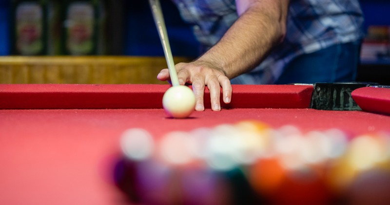 Customer playing pool