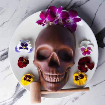 Served chocolate skull in the plate.