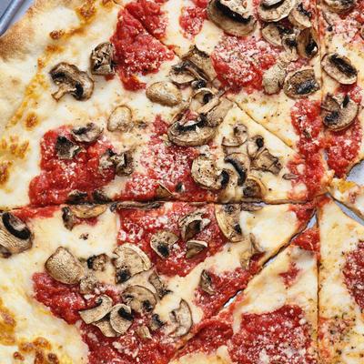 Sliced pizza with different toppings.