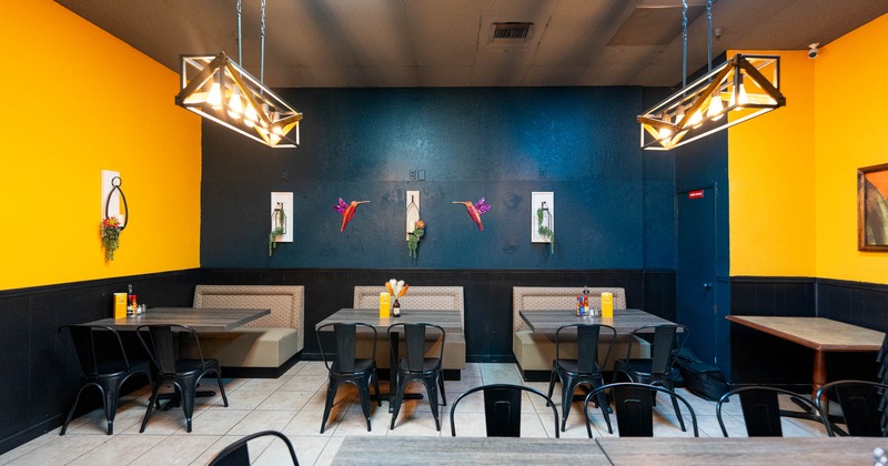 Interior, dining area with boots, tables and chairs