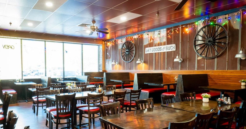 Interior, tables and chairs with booths in the back