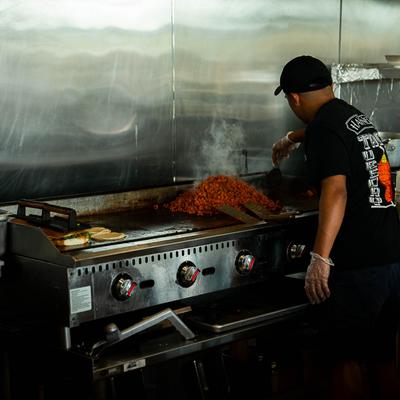 The cook in the kitchen.