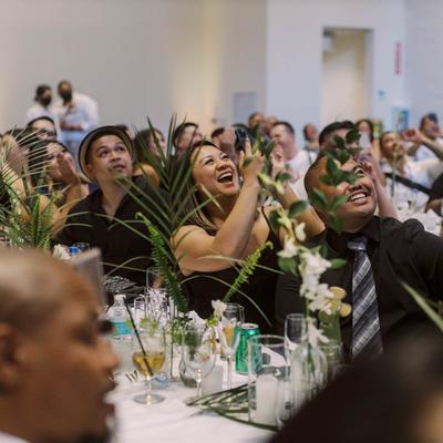Guests looking up and smiling.