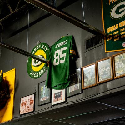 Sports memorabilia handing on the wall.