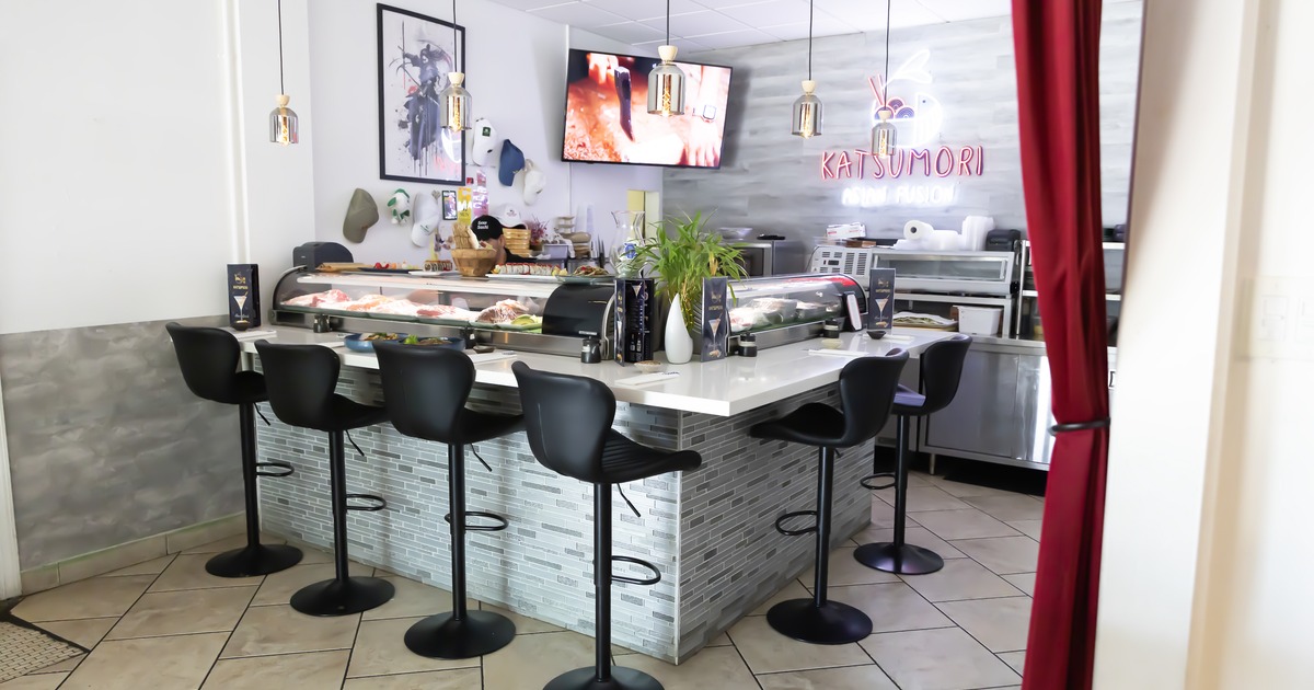 Interior, sushi bar, stools, tv screens