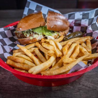 Mexican sub sandwich with fries.