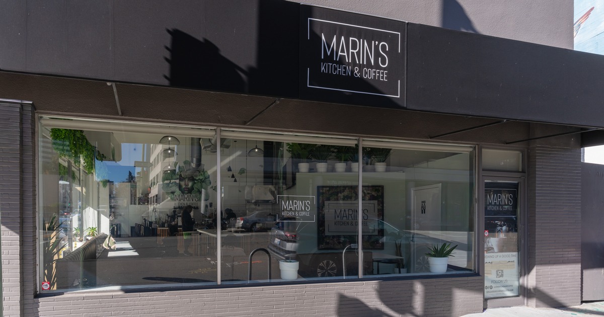 Exterior, front  view to restaurant, entrabnce, sign