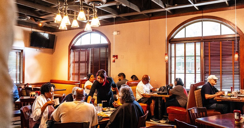 Interior, dining space, guests enjoying their meals and drinks